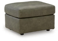 Olive-green upholstered ottoman with rounded top and short legs, square base.
