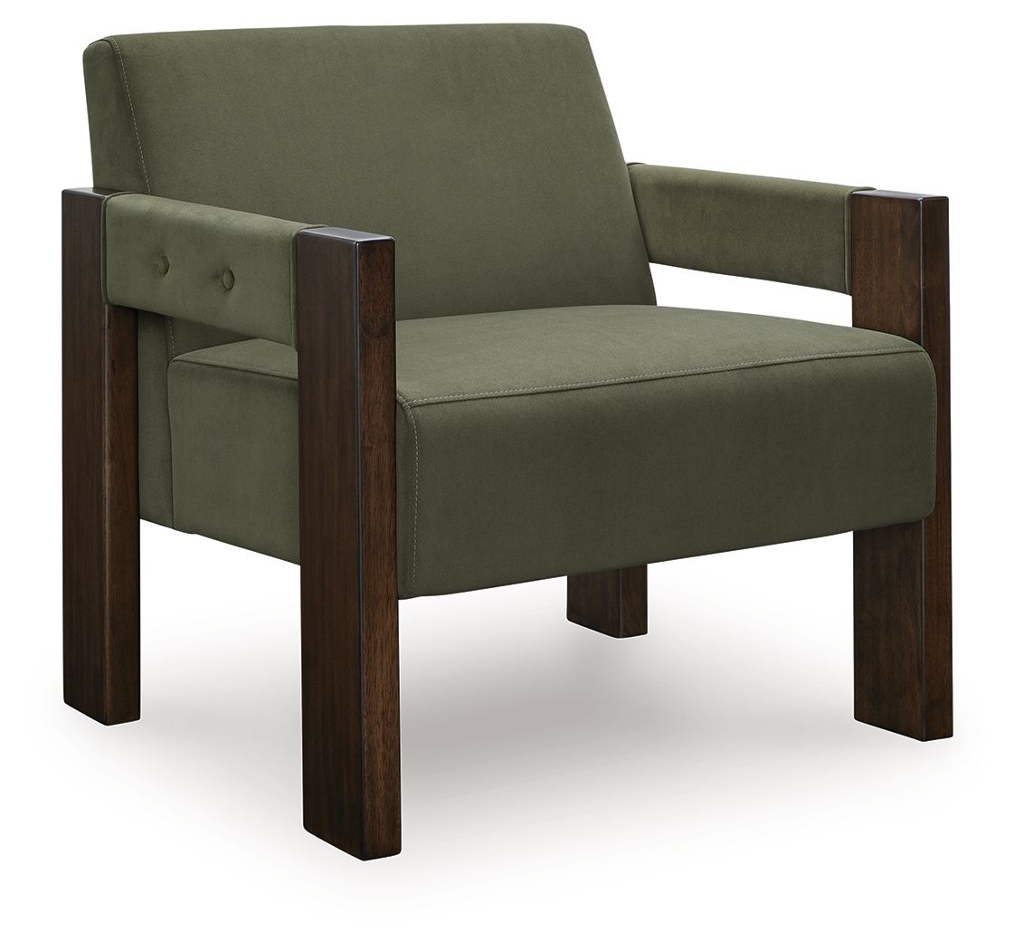 Green accent chair with dark wood arms and button-tufted back panel