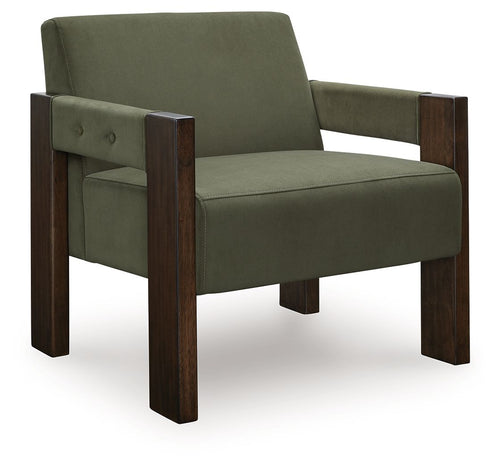 Green accent chair with dark wood arms and button-tufted back panel