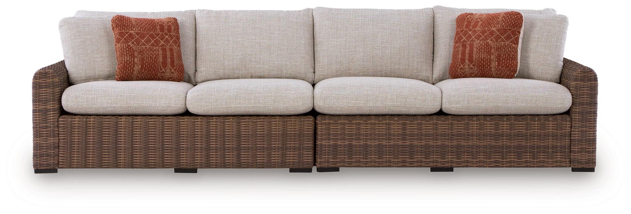 Outdoor loveseat set with beige seat cushions and brown woven frame, two rust accent pillows