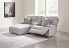Pewter reclining sectional sofa with chaise and patterned throw pillows