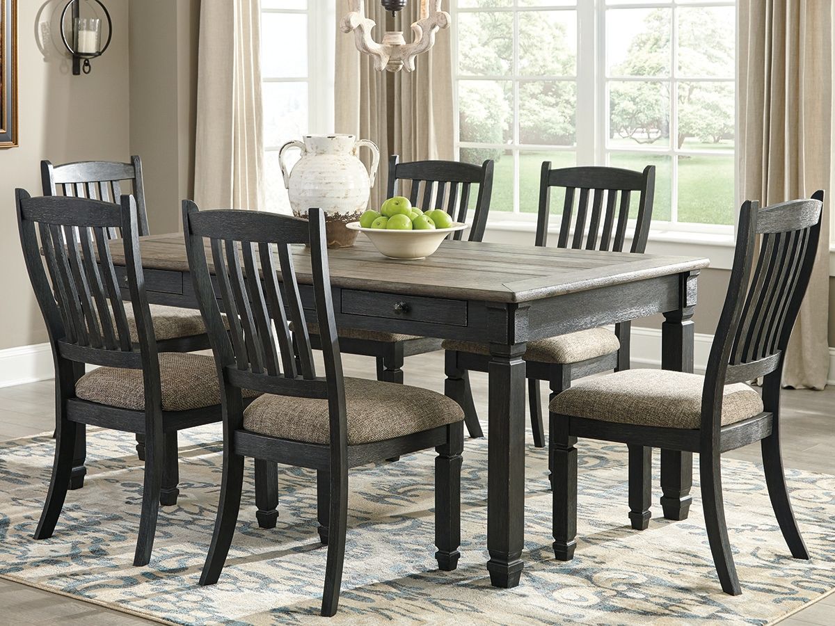 Rectangular dining table with gray tabletop and dark wood legs