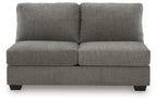 Gray armless loveseat with two-seat cushions, split back, and dark legs