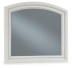 Antique white arched bedroom mirror with beveled frame