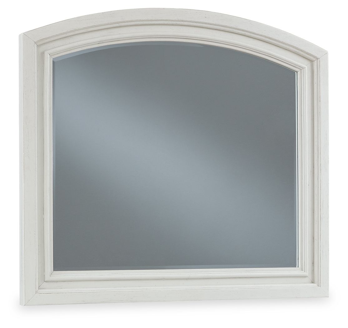 Antique white arched bedroom mirror with beveled frame