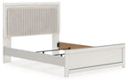 White upholstered panel bed with tall channel-tufted headboard and solid side rails