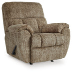 Taupe rocker recliner chair with rolled arms, padded headrest, side lever