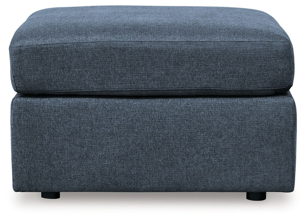 Ink blue fabric ottoman, front view, square lift-top with low legs