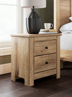 Light brown two-drawer night stand with black round knob pulls