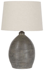 Gray ceramic table lamp base with beige fabric drum shade