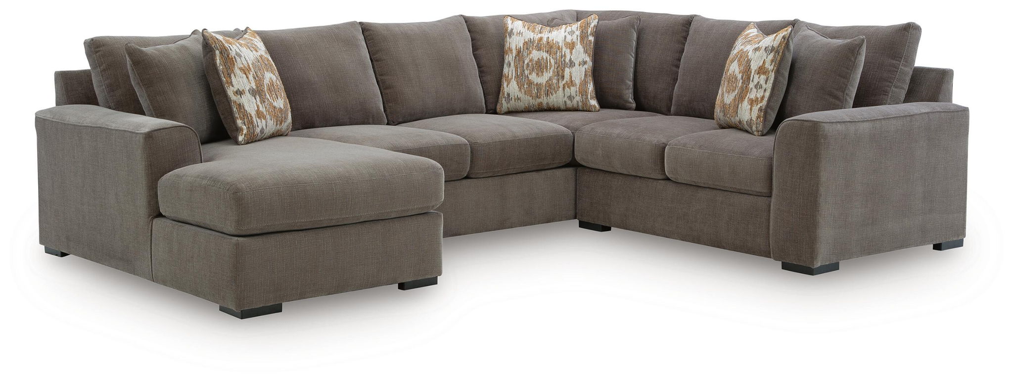Gray corner sectional sofa with chaise ottoman and patterned accent pillows