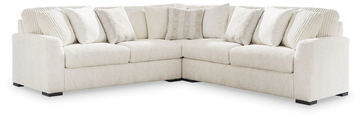 Ivory fabric sectional sofa with corner chaise and boxy arms, black feet