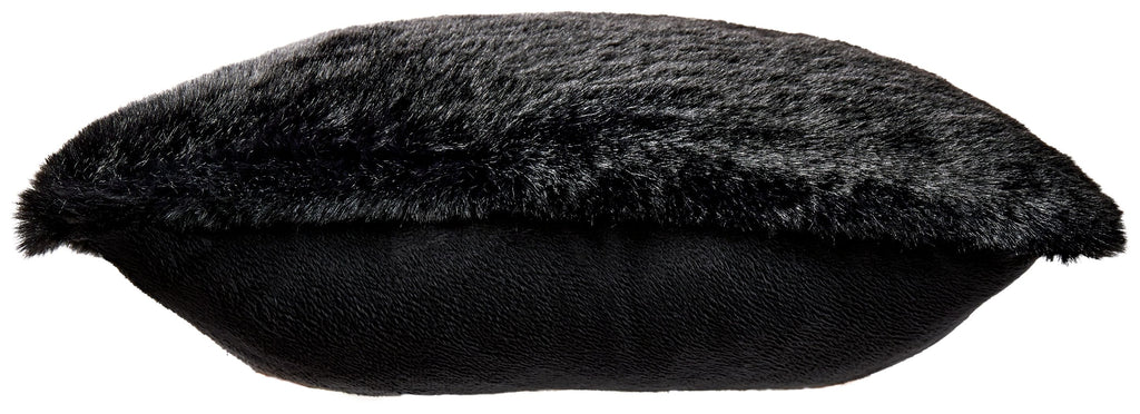 Black faux fur pillow with a dark smooth backing strip along the edge.
