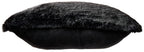 Black faux fur pillow with a dark smooth backing strip along the edge.