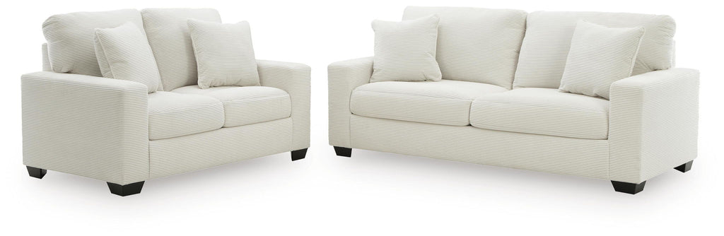 Light gray sofa and loveseat set with tuftless cushions and three back pillows