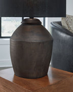 Table lamp with black fabric shade and rounded dark bronze base