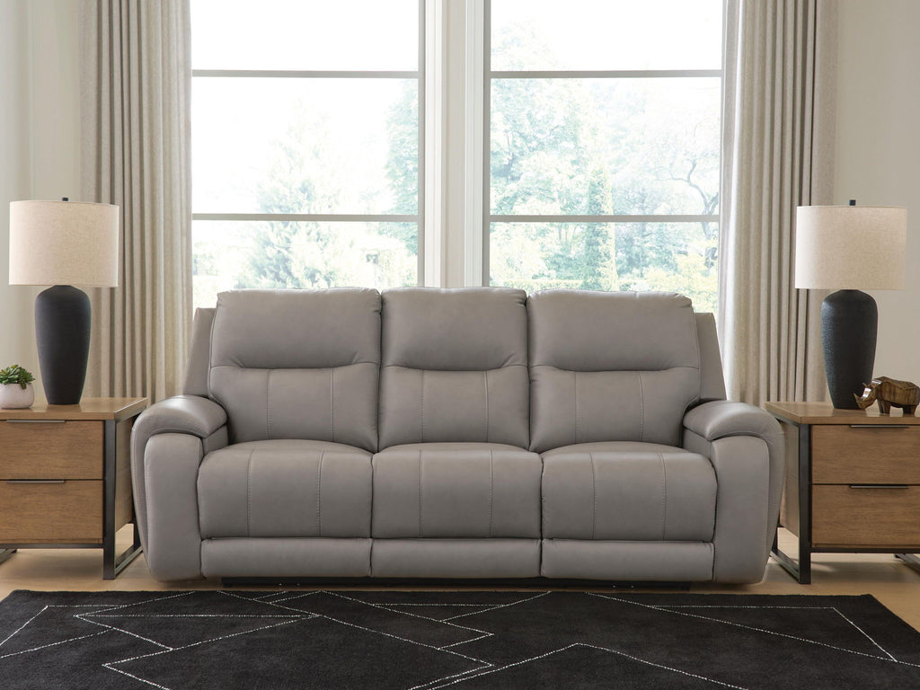 Ash-gray power reclining sofa with audio seating, three padded back cushions and armrests