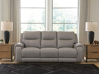 Ash-gray power reclining sofa with audio seating, three padded back cushions and armrests