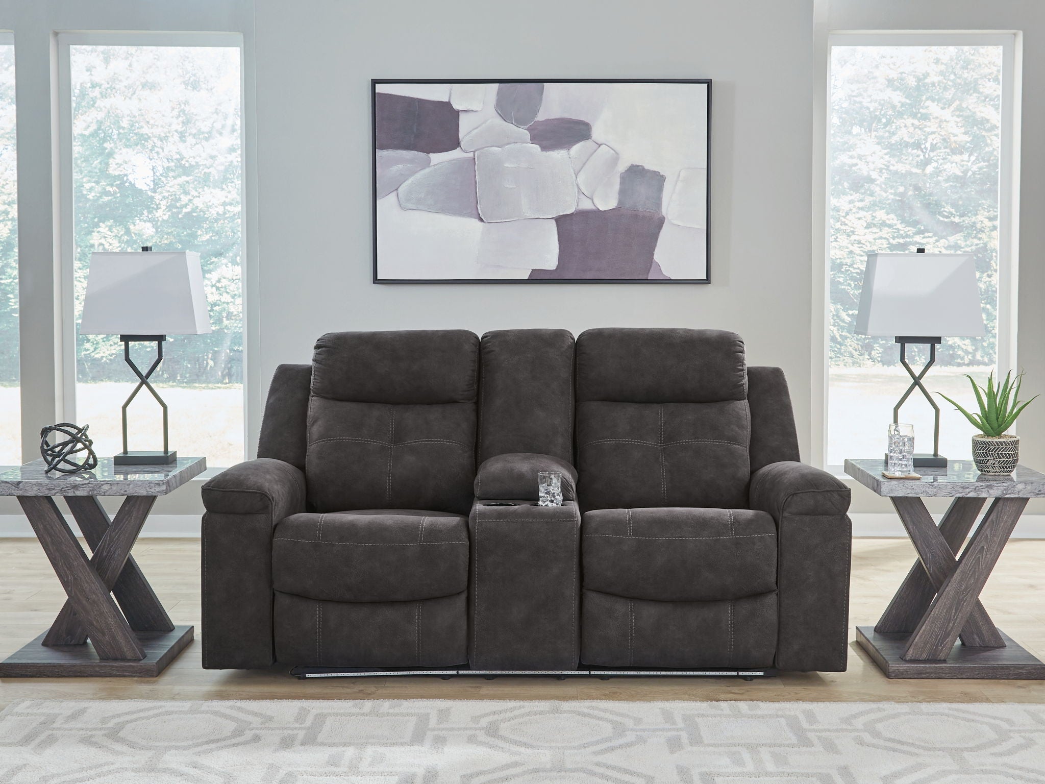 Charcoal double reclining loveseat with center console and cushioned arms