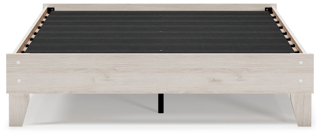 Light beige platform bed frame with black slat support and timber panels