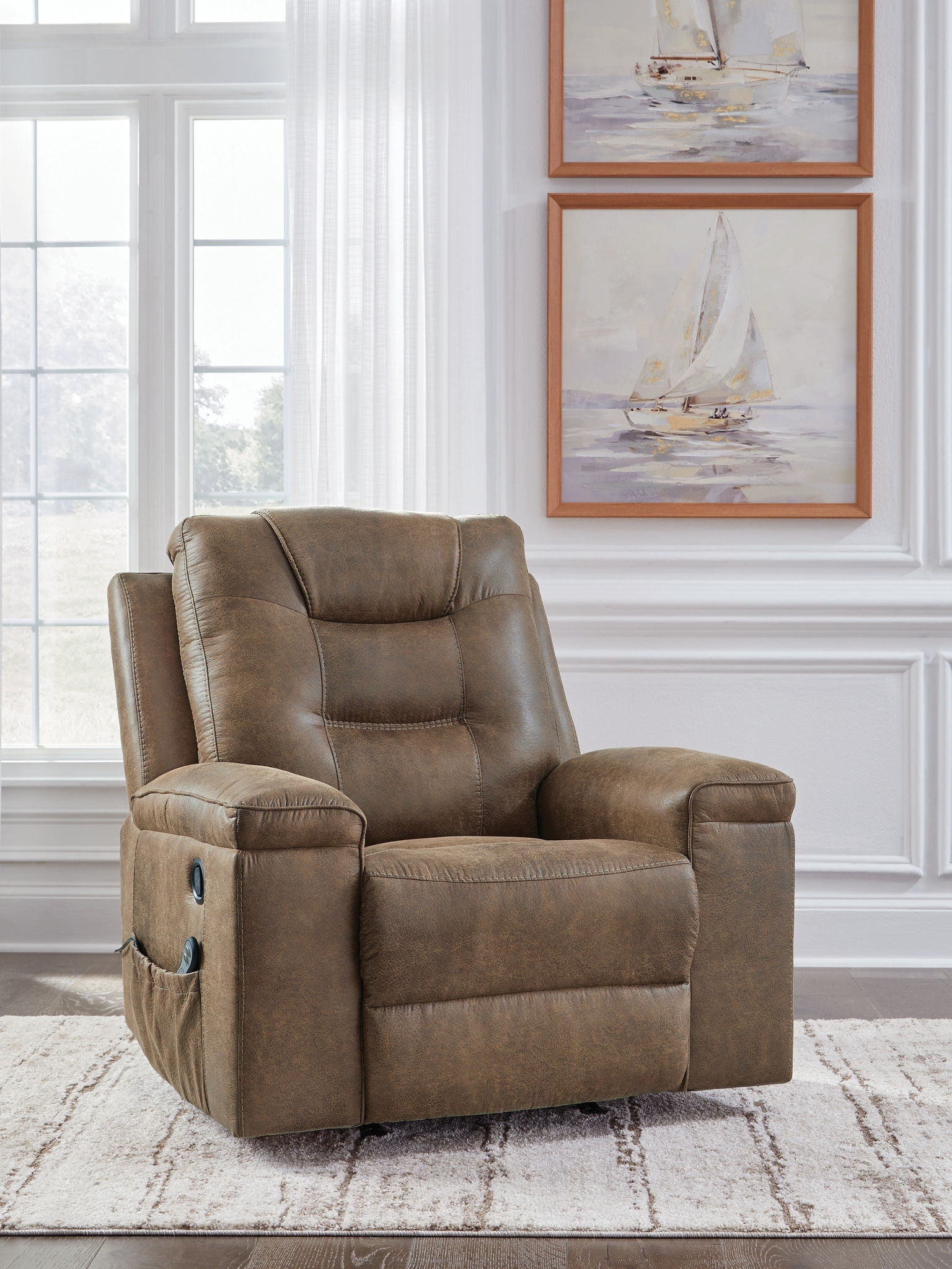 Earth-toned rocker recliner chair with tufted back, padded arms, and side storage pockets
