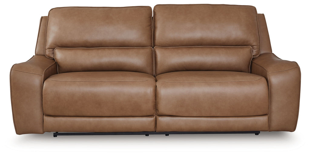Medium brown power reclining sofa with split back and padded headrests