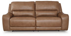 Medium brown power reclining sofa with split back and padded headrests