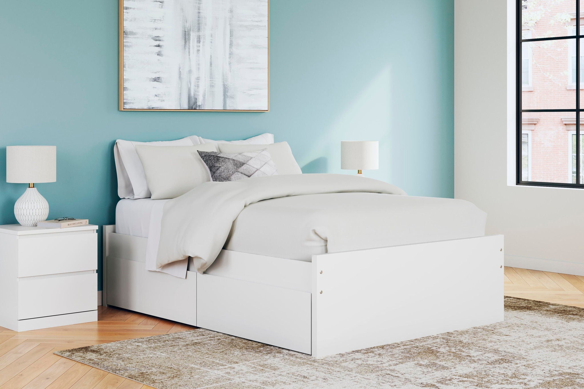 White upholstered-looking platform bed with two side drawers and slat base