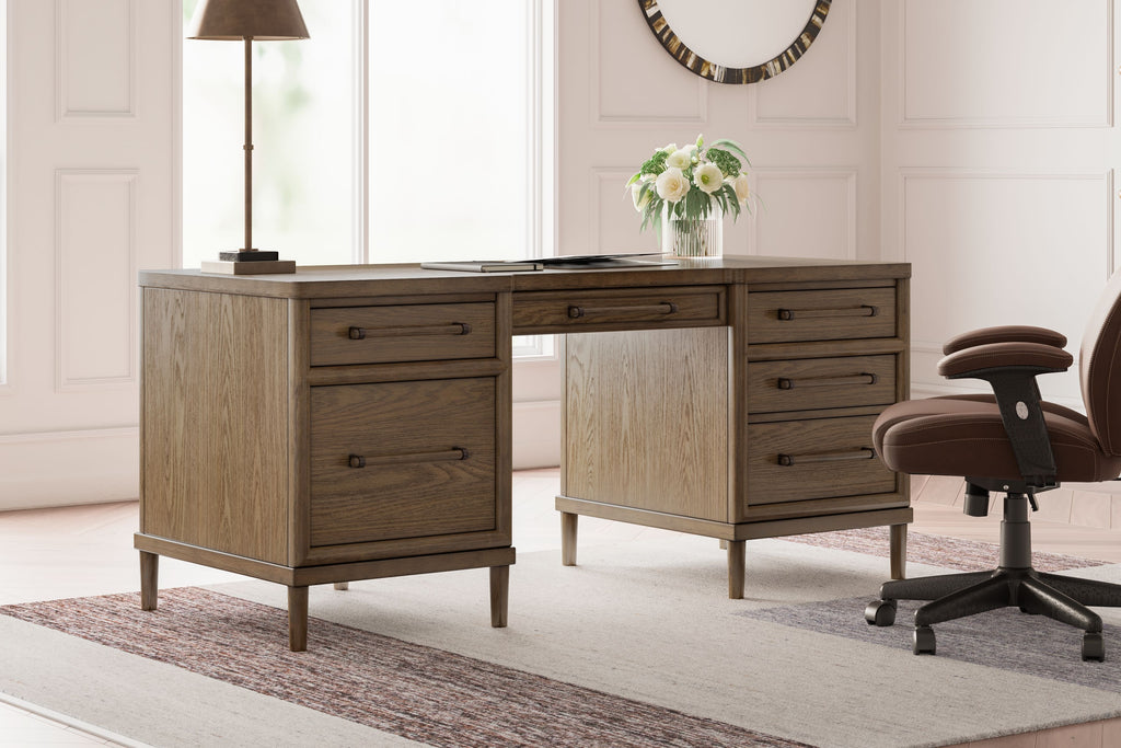 Brown home office desk with multiple drawers, open center, and simple legs