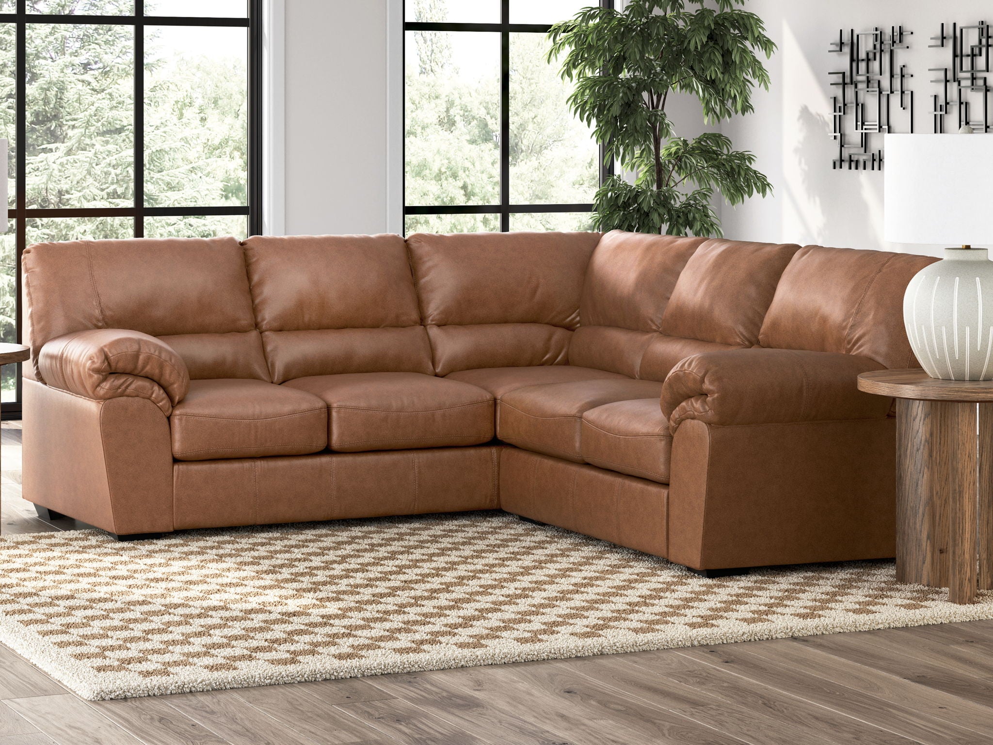 Brown sectional sofa with tufted cushions and curved armrests