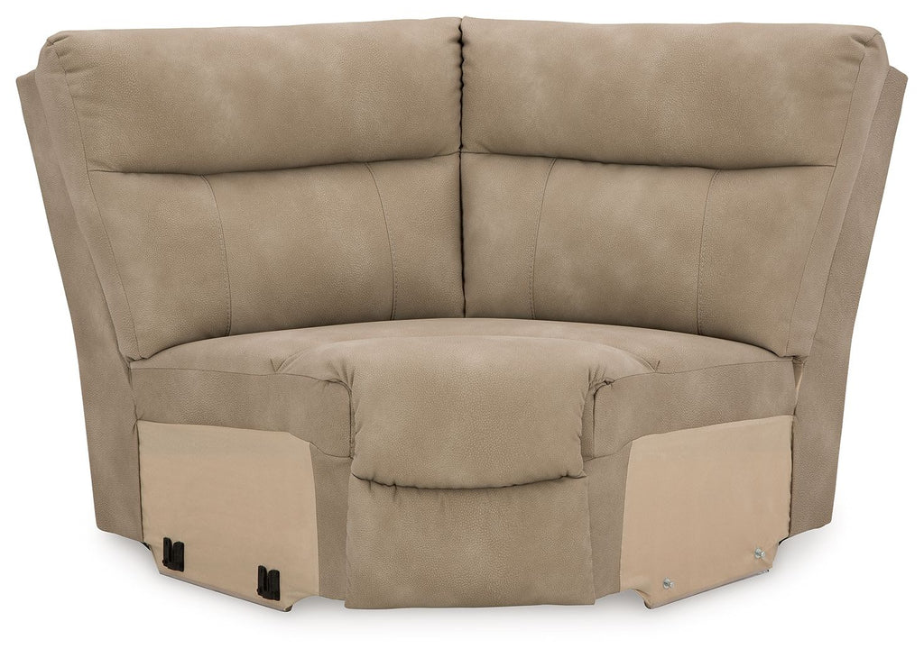 Sand-colored wedge sofa with padded arms and button-tufted back
