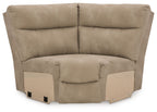 Sand-colored wedge sofa with padded arms and button-tufted back