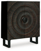 Distressed black accent cabinet with circular radiating metal door panel
