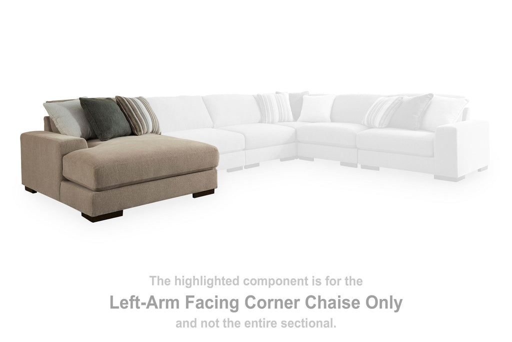 Left-arm facing corner chaise with beige upholstery and green throw pillows