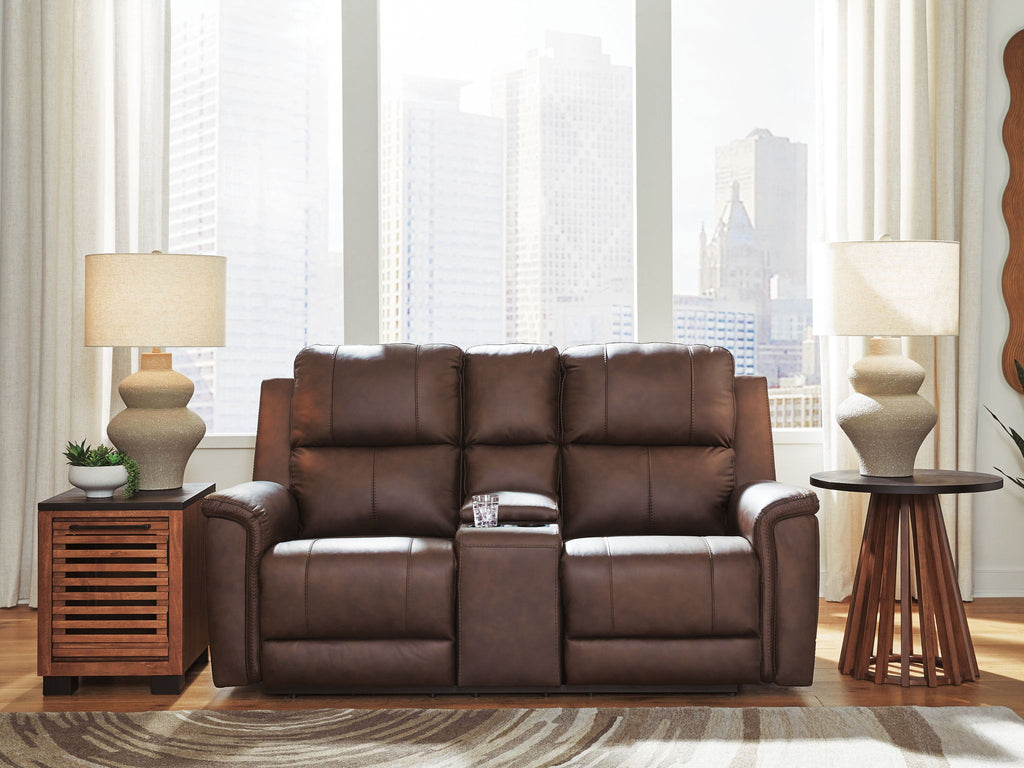 Power reclining loveseat with console, dark brown upholstery in a living room setting