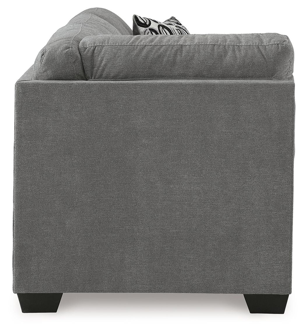 Gray fabric corner sofa with square arms, dark legs, and patterned cushions on top