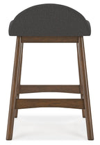 Upholstered barstool with dark gray fabric seat and back, wooden legs