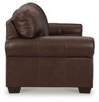 Dark brown upholstered sofa with rounded arm and stitched panel details