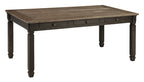 Dark gray rectangular dining table with turned legs and drawer apron