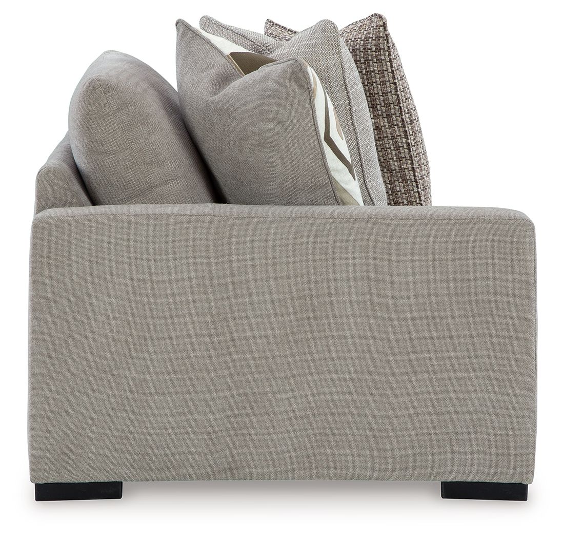 Pebble gray corner chair front with boxy arms and short black legs