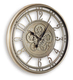 Champagne wall clock with open gear dial and Roman numerals, black hands