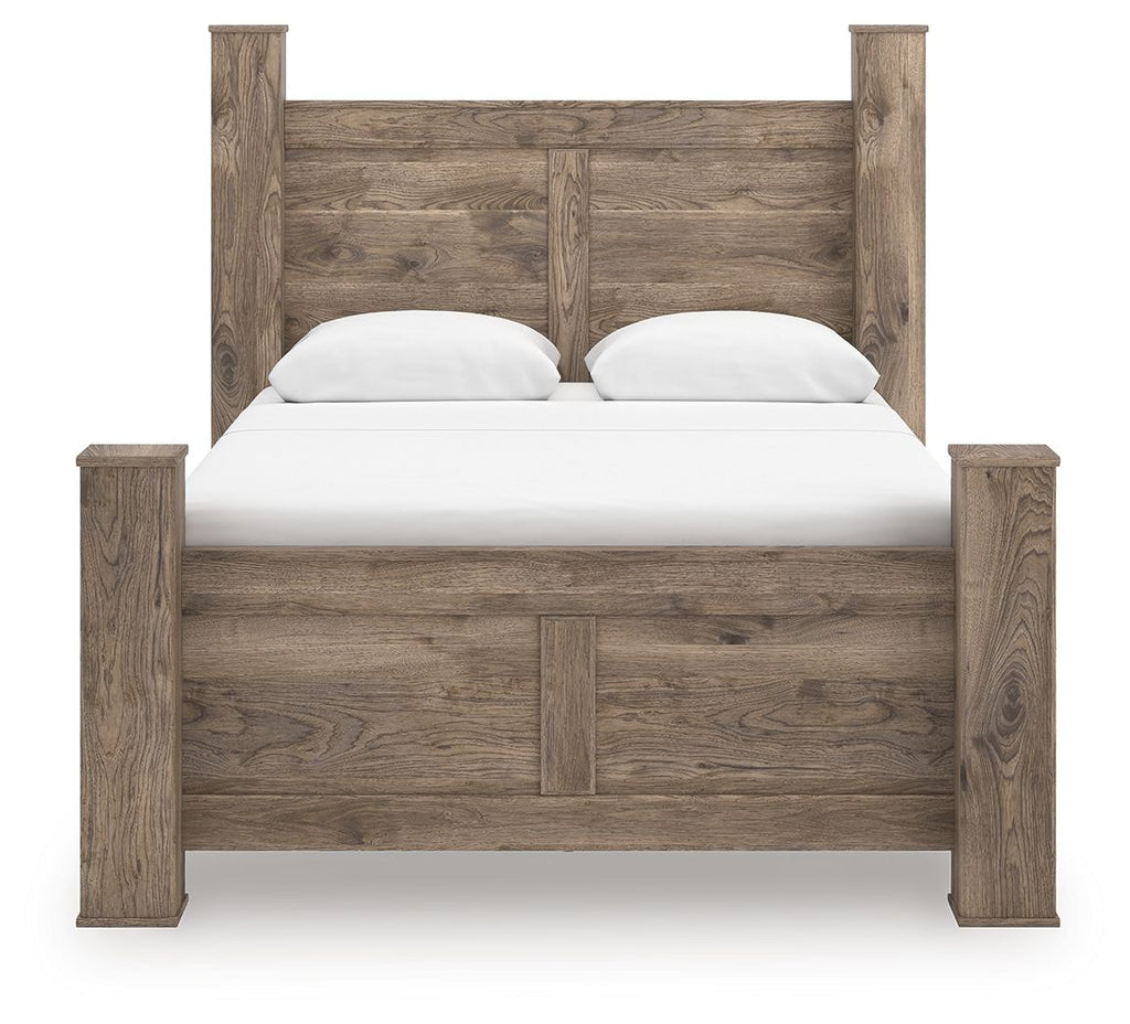 Light brown poster bed with paneled headboard, white mattress, and two pillows