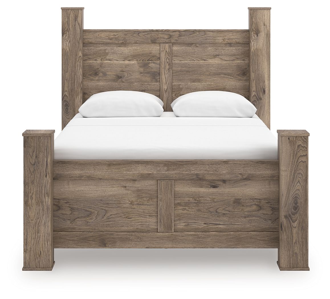 Light brown poster bed with paneled headboard, white mattress, and two pillows