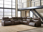 Dark brown power reclining sectional sofa with padded headrests and reclined chaise