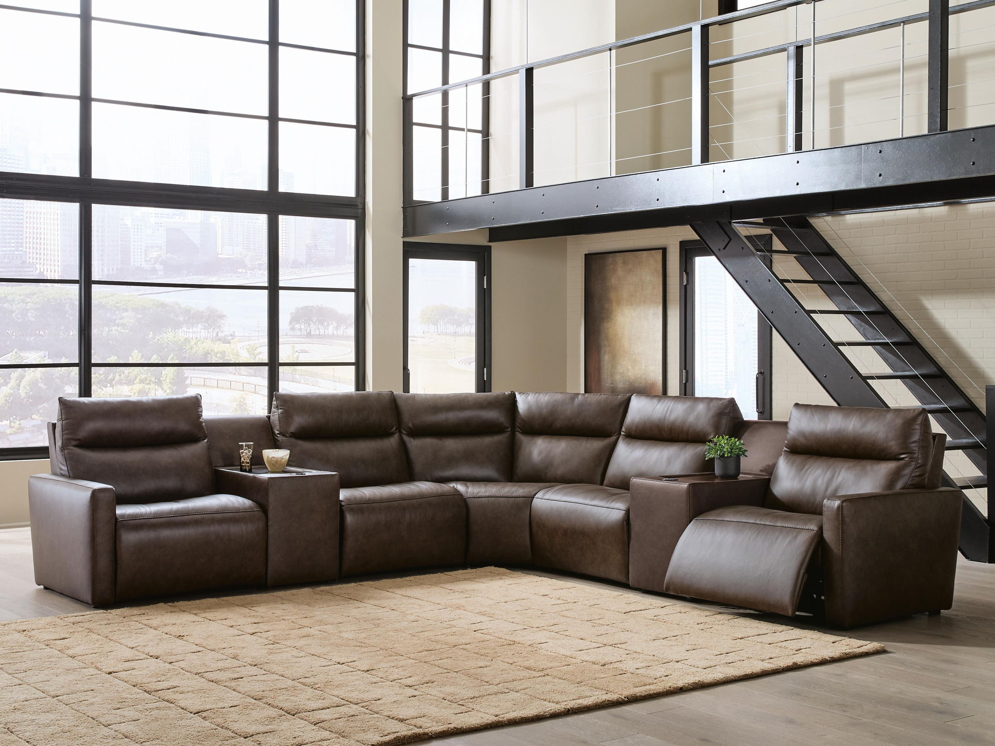 Dark brown power reclining sectional sofa with padded headrests and reclined chaise