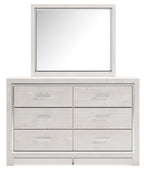 White dresser with mirror, mirror above six drawer cabinet with metal bar pulls