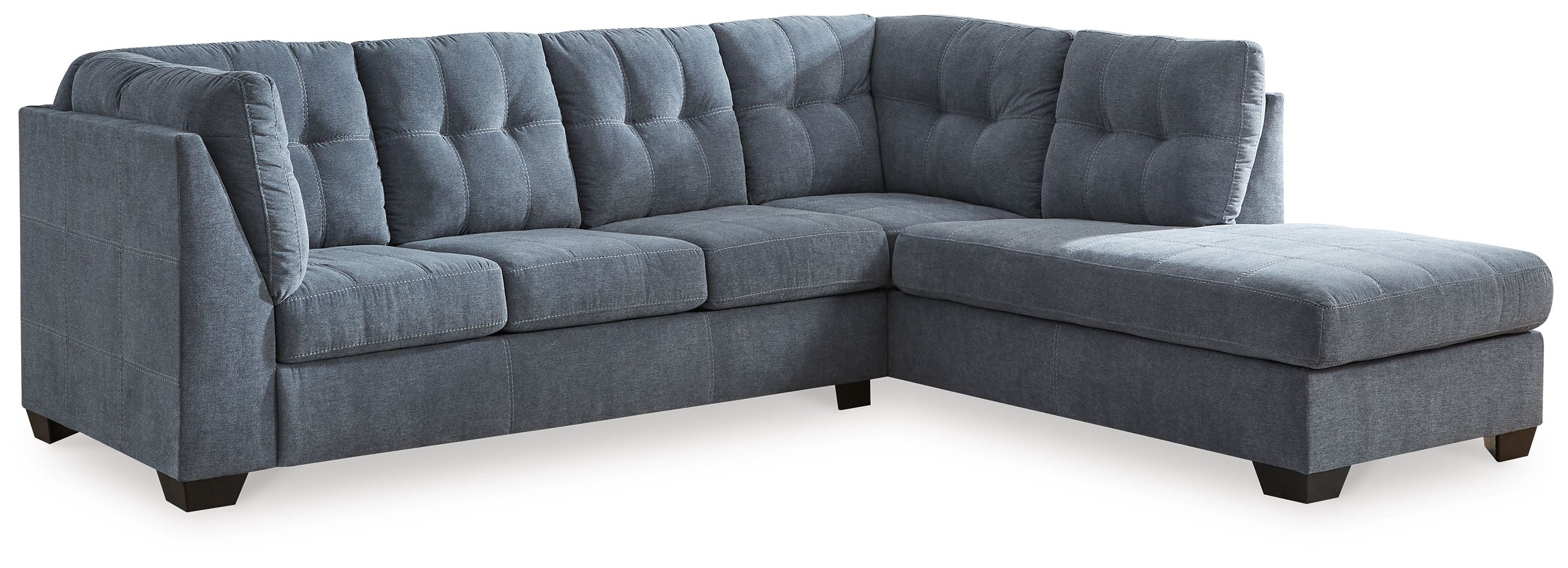 Blue sectional sleeper sofa with tufted back cushions and chaise corner, thick arms