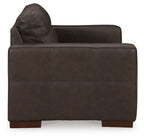 Dark brown loveseat with curved backrest and cushioned seat and arms