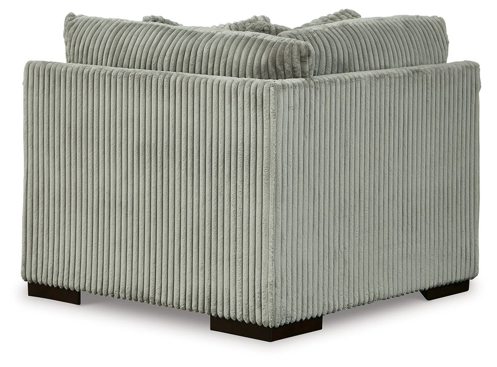 Light gray wedge sofa section with ribbed upholstery, deep seat, and square arms