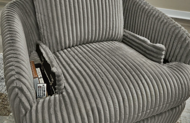 Gray ribbed recliner with armrest console and remote tucked in side pocket.